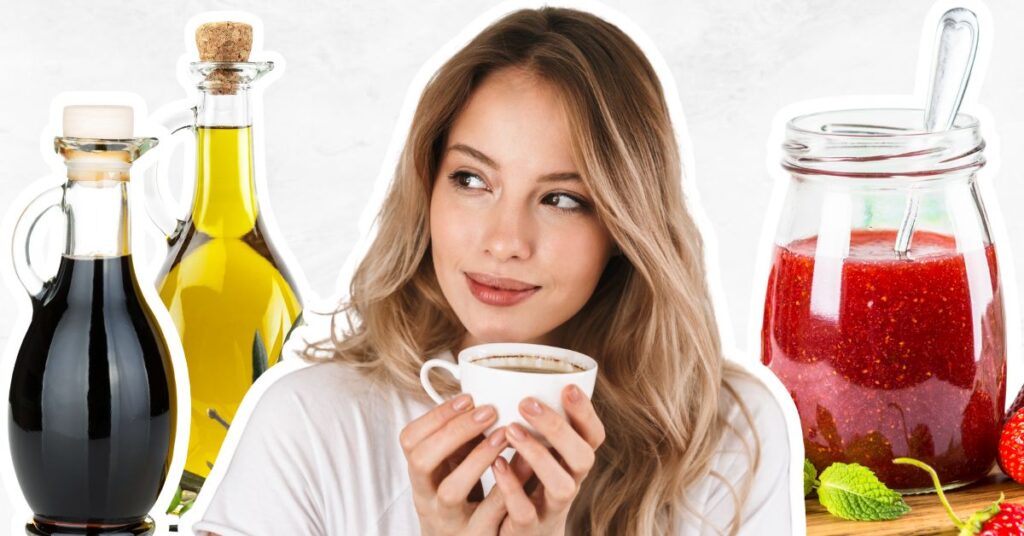 Woman drinking speciality coffee, jam in a jar, and a bottle of olive oil and vinegar to show food gift ideas.
