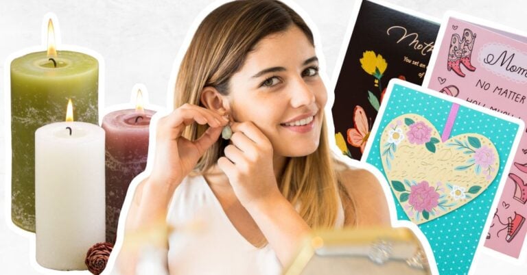 Woman trying on earrings and home made greeting cards and candles.