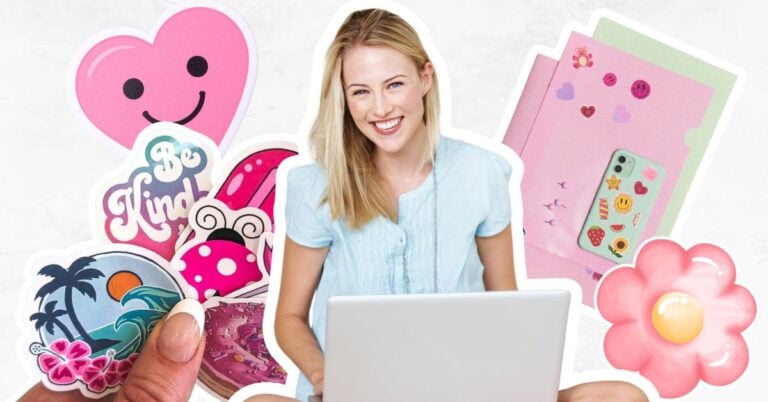 Woman sat on laptop creating stickers and a variety of stickers placed around her.